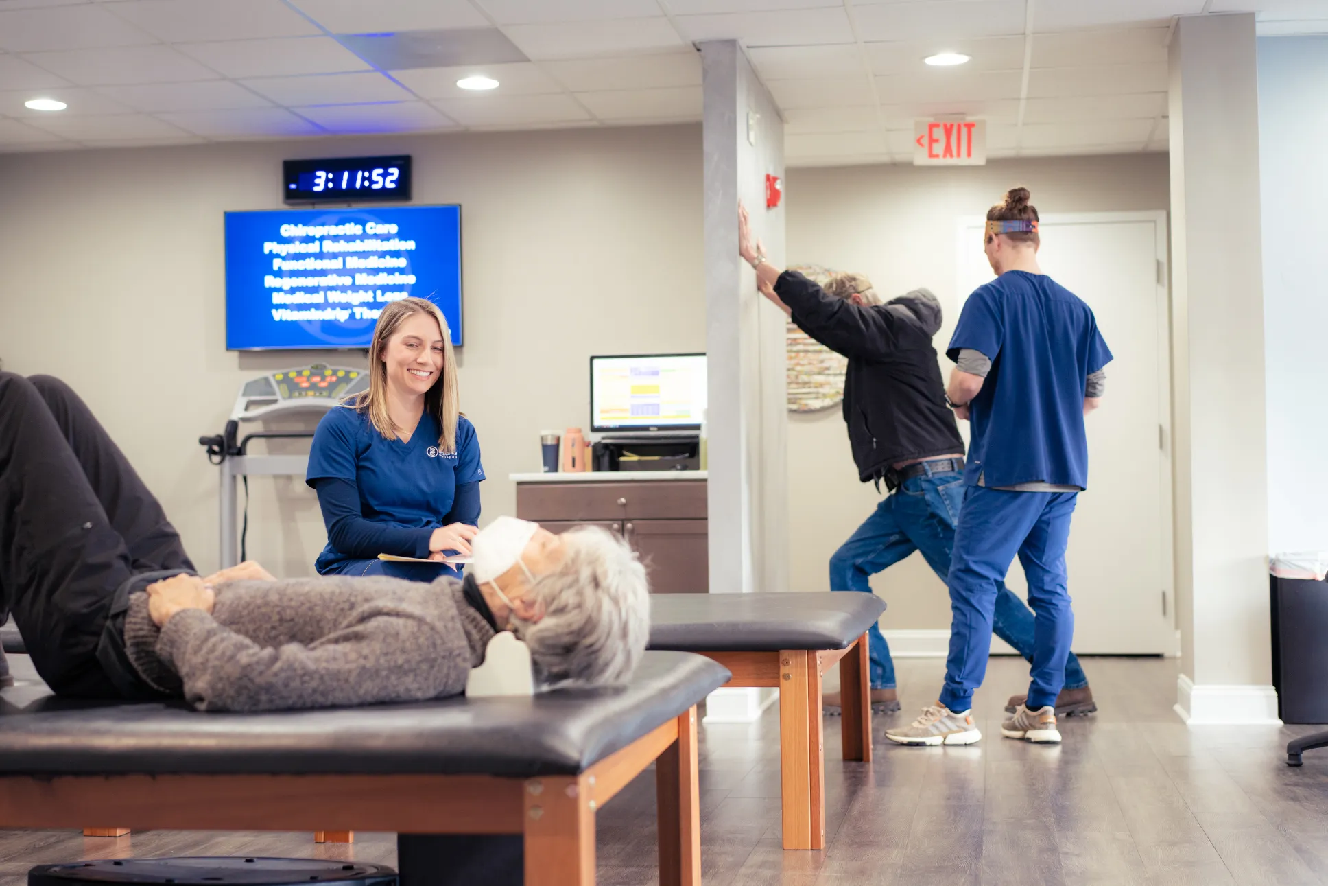 Therapist guiding patient through rehabilitation exercise