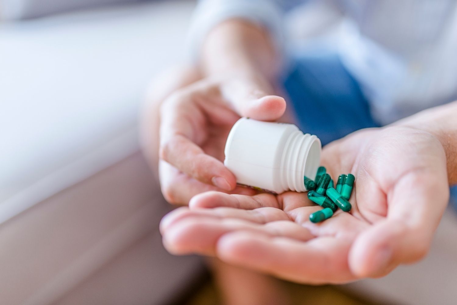 Person holding medicines for neuropathy treatment