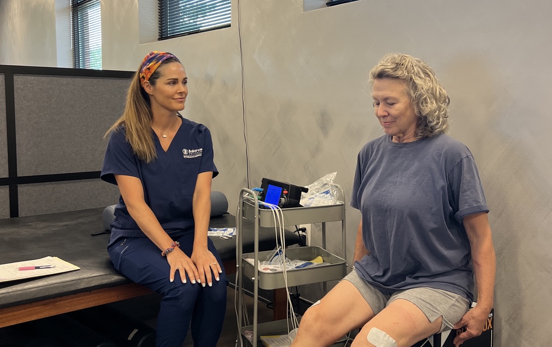 A healthcare professional at Balance Wellspace provides a compassionate consultation for a woman seeking relief from chronic pelvic pain.