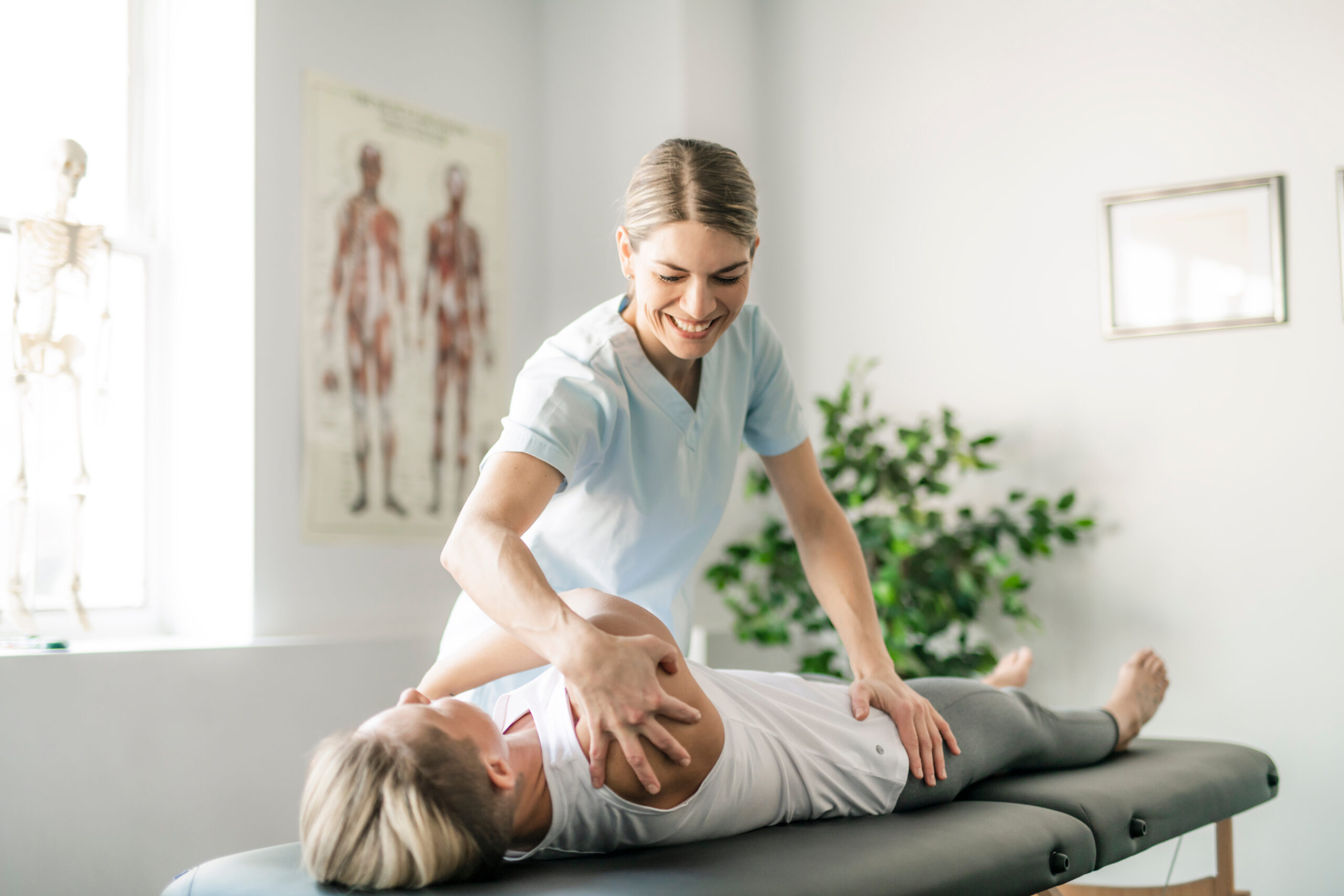 A chiropractor at Balance Wellspace providing a targeted spinal adjustment to a Roanoke resident to improve mobility and active living.